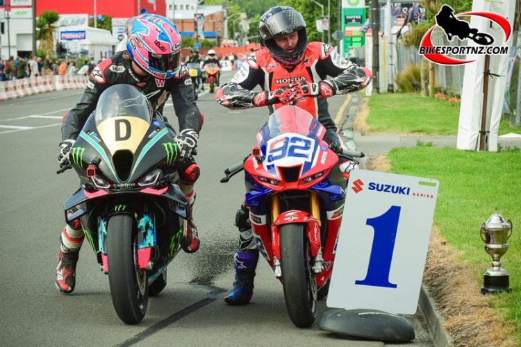 Whakatane’s Mitch Rees (bike No.92) cracked the ‘double’ once again, winning both the premier Formula one/Superbike class overall and taking the Robert Holden Memorial feature race win as well. He is congratulated here by visiting UK rider Davey Todd.